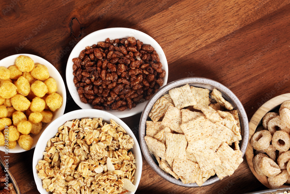 Cereal. Bowls of various cereals and milk for breakfast. Muesli with kids cereals. Cereal. Bowls of various cereals and milk for breakfast. Muesli with kids cereals.