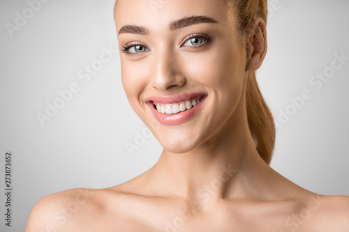 Facial Treatment. Beautiful Woman with Clean Fresh Skin