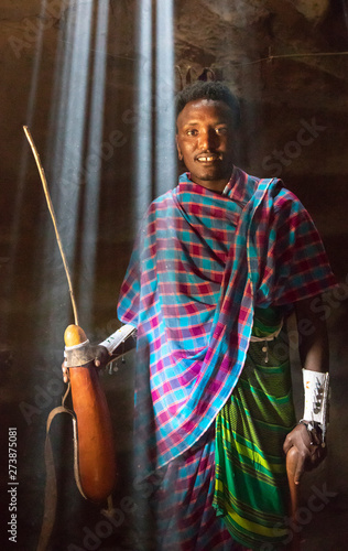 Maasai man in the traditional house photo