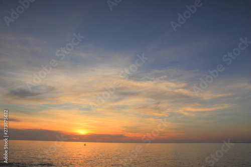 Beautiful sunset on the beach Sea on the twilight sky for background.