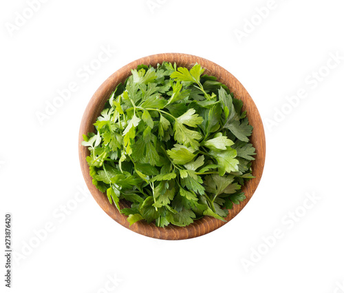 Parsley isolated on white background. Top view. Parsley leaves with copy space for text. Herbs isolated on white. Parsley leaves on white background.