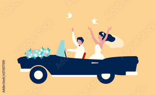 Happy bride and groom riding on the cabriolet