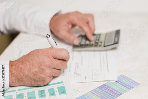 Businessman using calculator