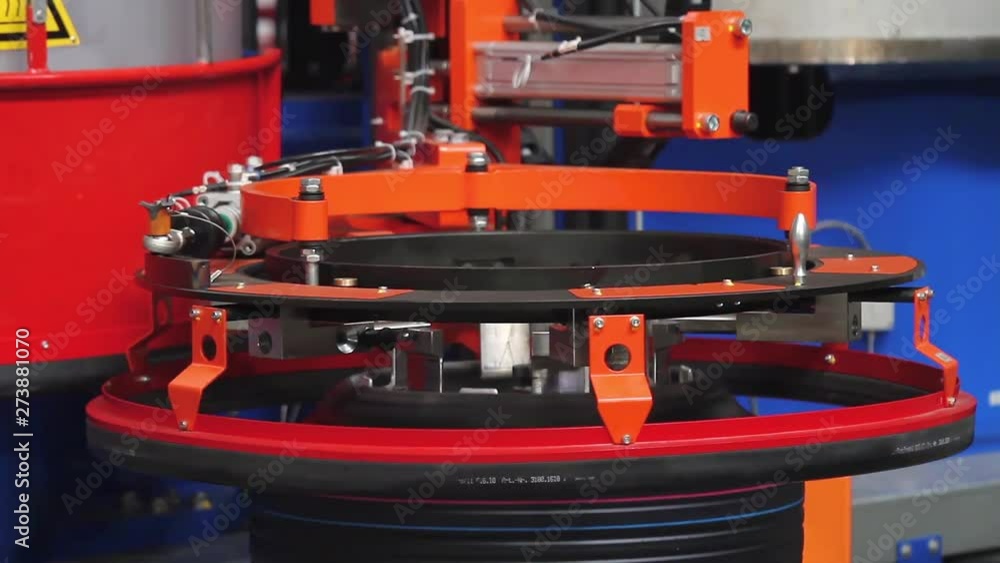 Molding press for the production of automobile tires. Production process of tires on modern equipment in the factory. Modern automated tire forming tires machine. Manufacture of automobile tyres. Molding press for the production of automobile tires. Production process of tires on modern equipment in the factory. Modern automated tire forming tires machine. Manufacture of automobile tyres.