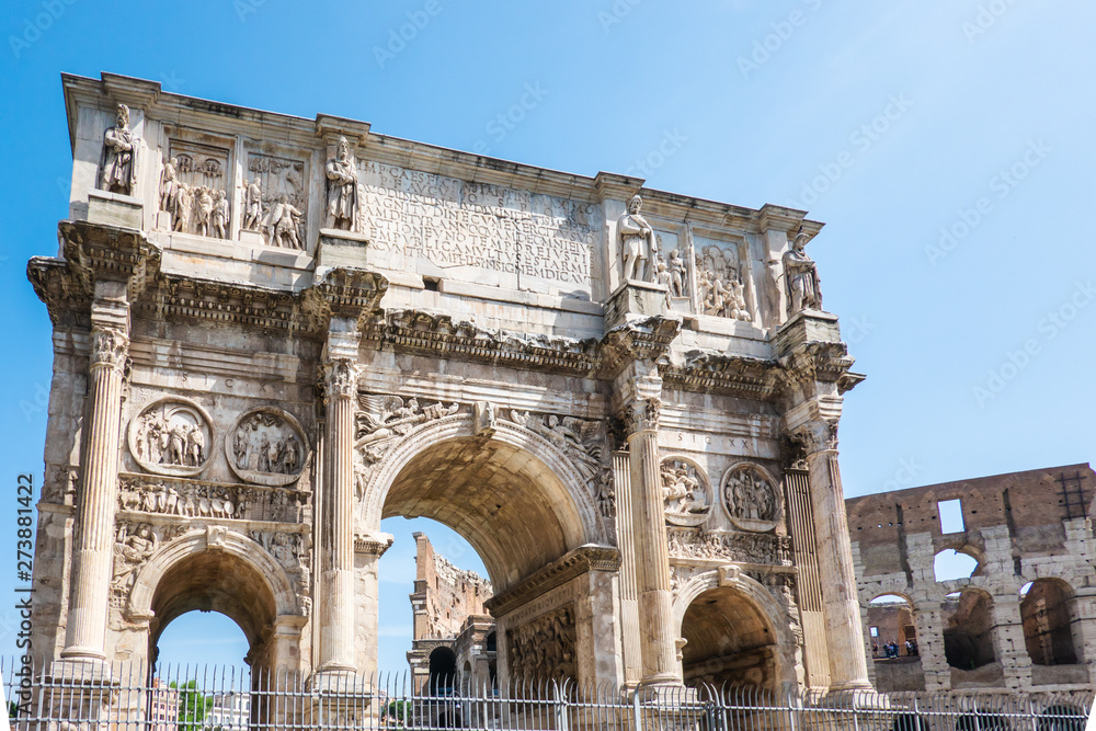 ROME, Italy: The Arch of Constantine in Rome with Colosseum in background. Arco di Costantino.