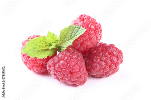 Ripe raspberries with green leafs isolated on white background