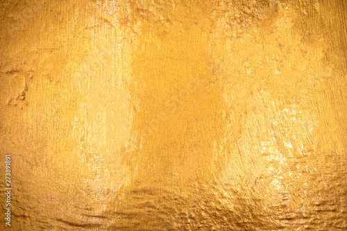 Gold texture with stone background. Detail of Golden surface made from rock.