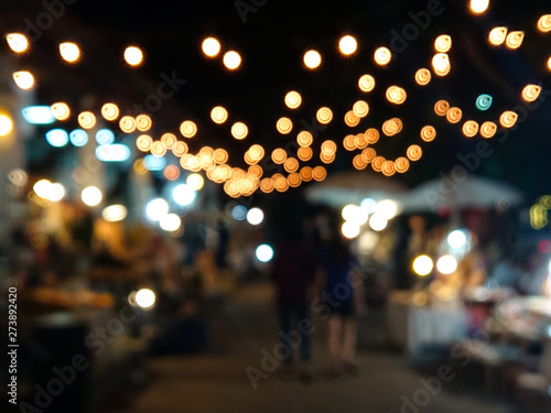 Abstracts with bokeh blured background lights on night walking street