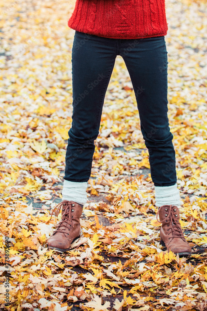 Woman wearing brown boots- partial view Woman wearing brown boots- partial view