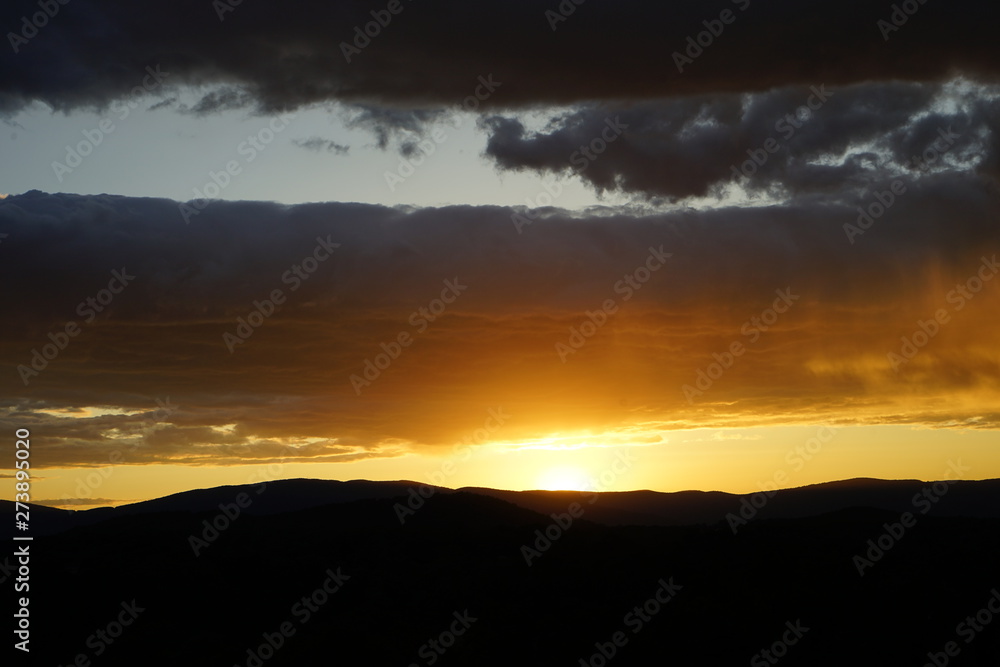 Sunset Over Mountains with Clouds