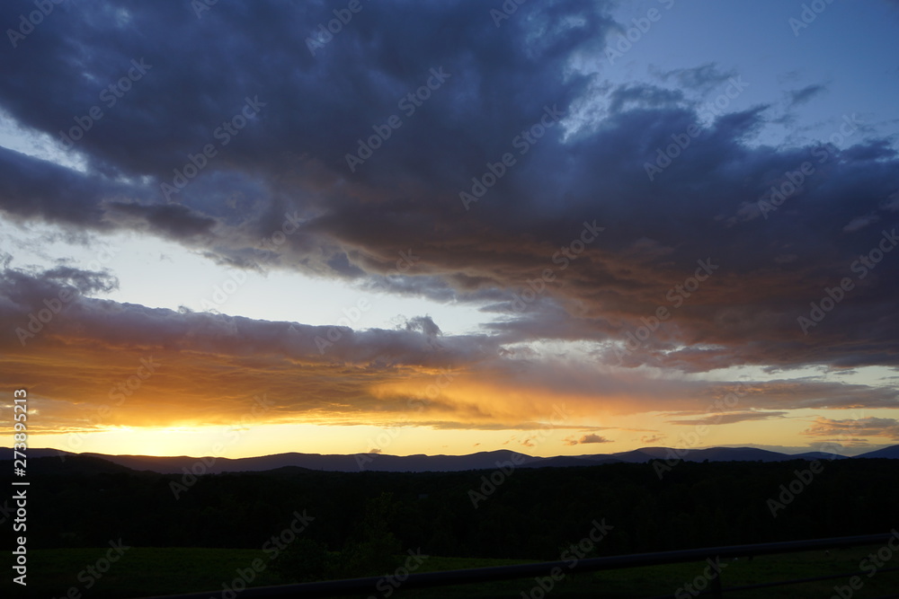 Brilliant Sunset with Clouds Over Mountains Brilliant Sunset with Clouds Over Mountains