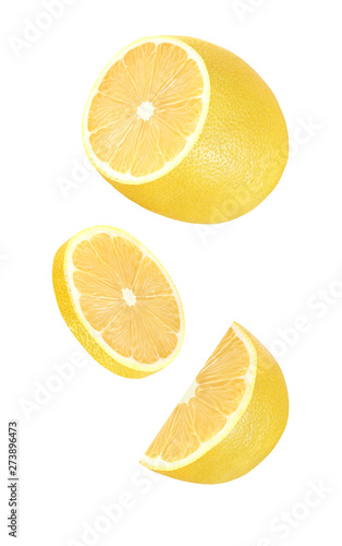 Parts of the lemon half soaring, falling, flying isolated on white background with clipping path.