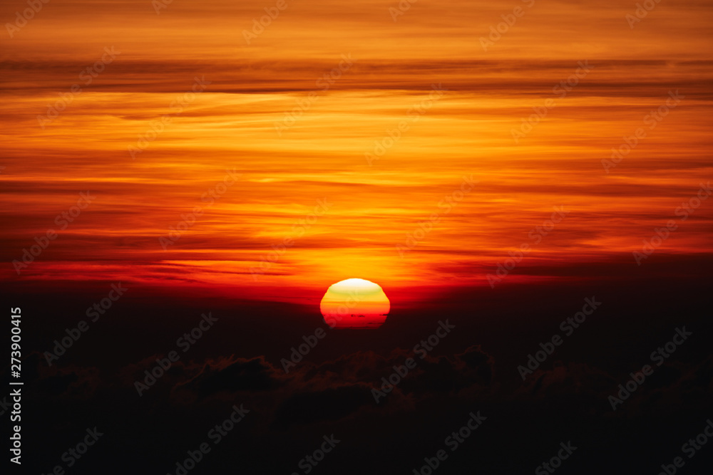 Sunrise / sunset over the clouds and horizon in golden colors. Sunrise / sunset over the clouds and horizon in golden colors.