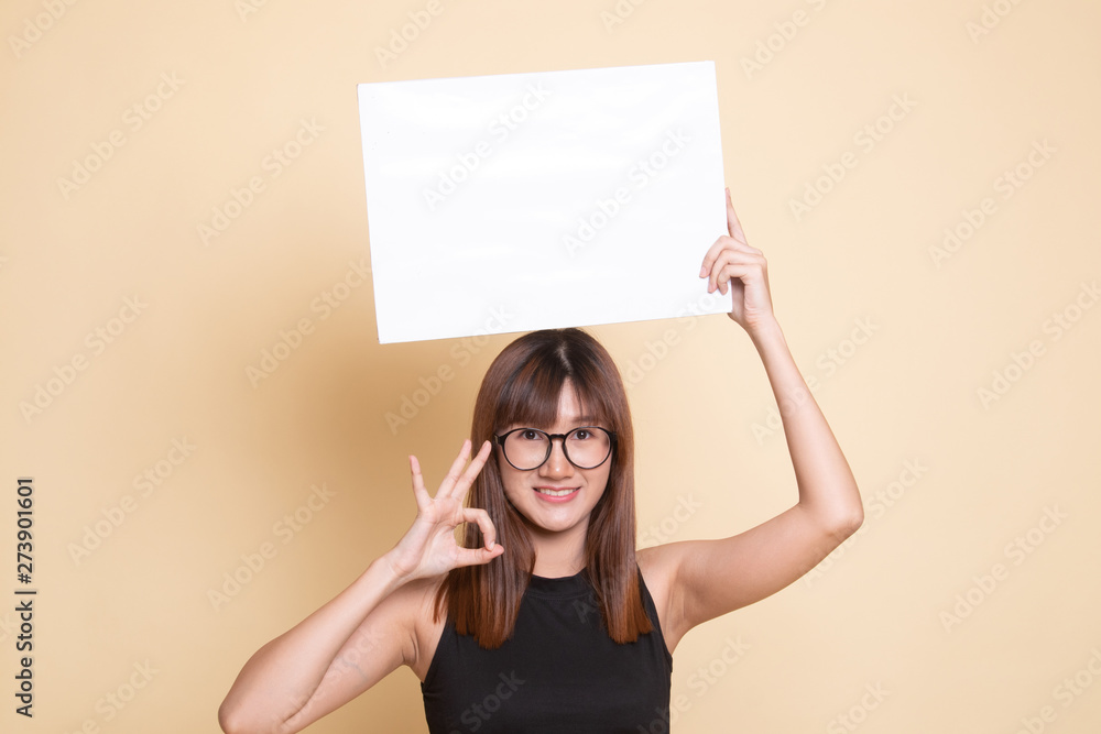 Young Asian woman show OK with white blank sign. Young Asian woman show OK with white blank sign.
