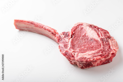 isolated tomahawk ribeye steak on white background