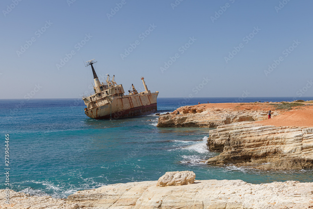 CYPRUS - MARCH, 30, 2018: Rusty abandoned ship Edro III near Paphos beach. The most attractive shipwreck of Cyprus island. Sunny summer day.
