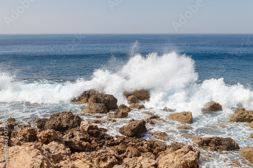 Powerful waves splashing on a rocky beach of Cyprus