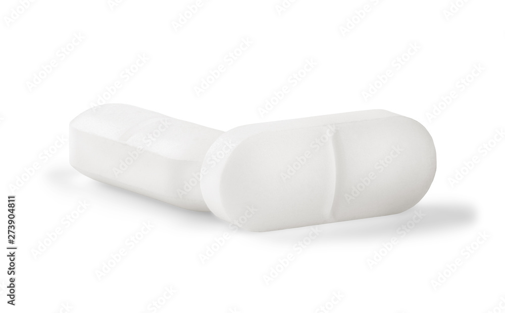 Two medical pills in white color on white isolated background with shadow. Two medical pills in white color on white isolated background with shadow.