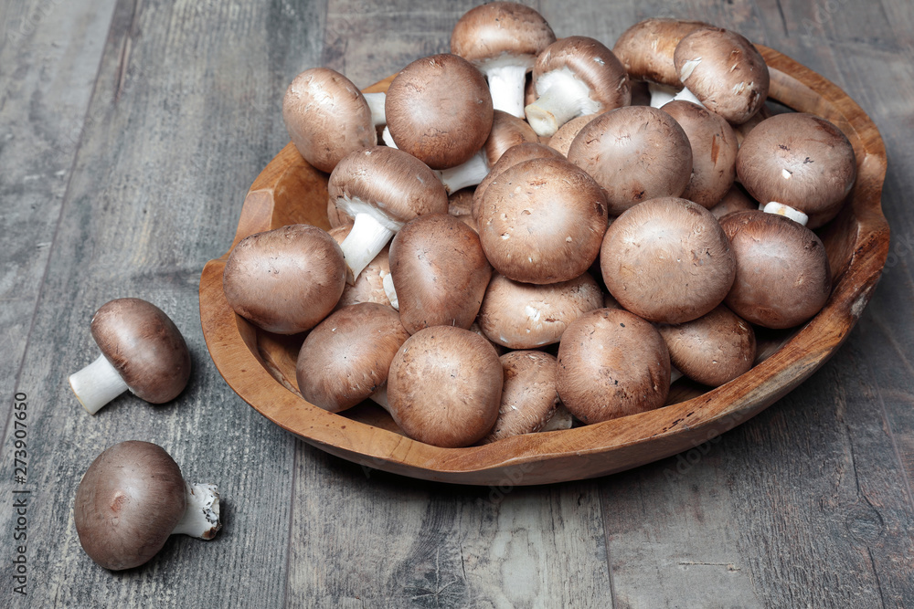 A lot of champignions in the wooden box A lot of champignions in the wooden box