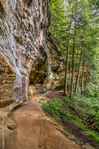 Cliffside Forest Trail - A forest trail follows the base of a weathered sandstone cliff in the Hocking Hills of Ohio.
