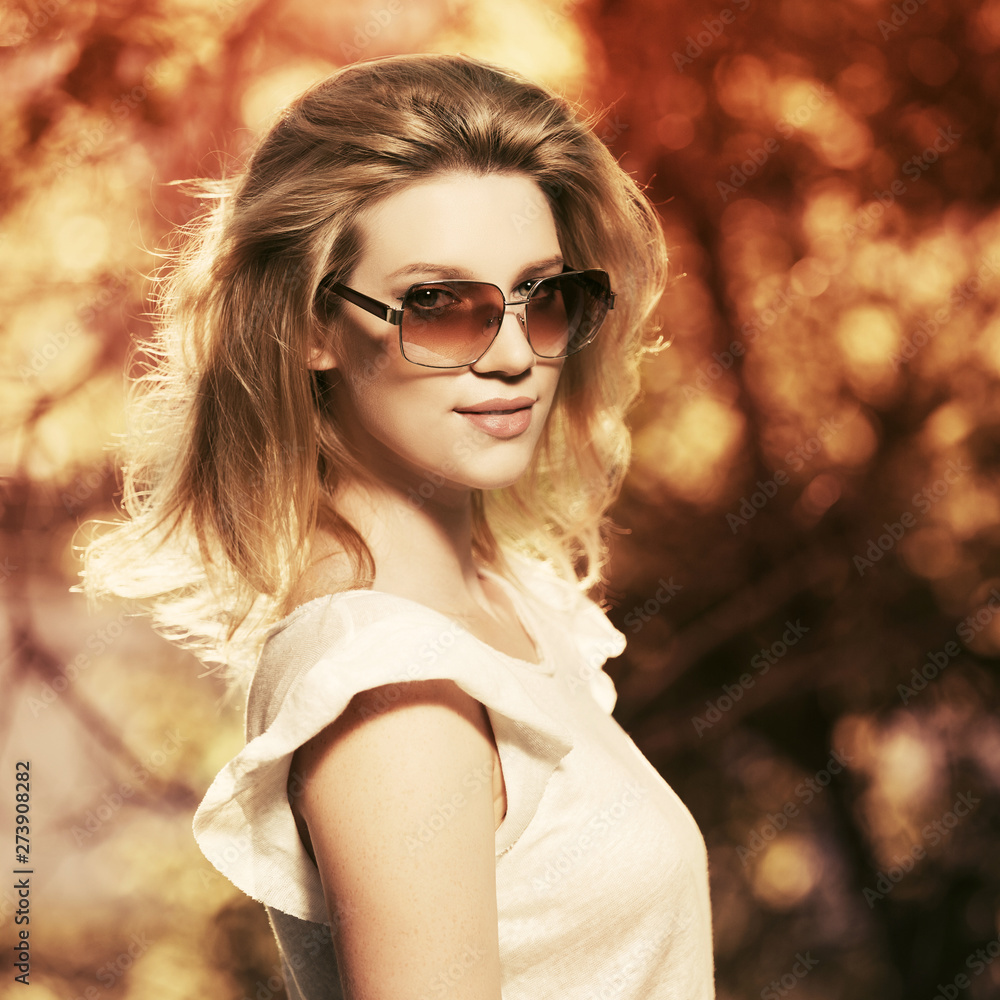 Happy young fashion blonde woman in city park Happy young fashion blonde woman in city park