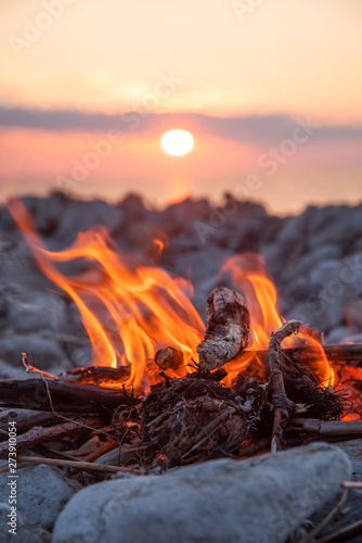 fire burns near the sea photo