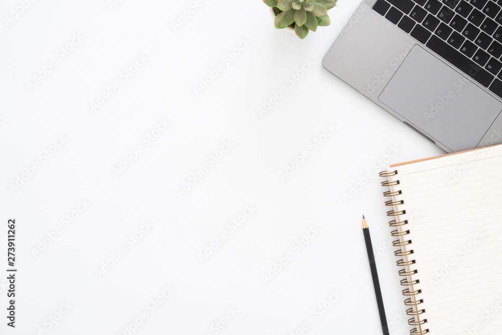 Creative flat lay photo of workspace desk. Top view office desk with laptop, pencil, notebook and plant on white color background. Top view with copy space, flat lay photography. Creative flat lay photo of workspace desk. Top view office desk with laptop, pencil, notebook and plant on white color background. Top view with copy space, flat lay photography.