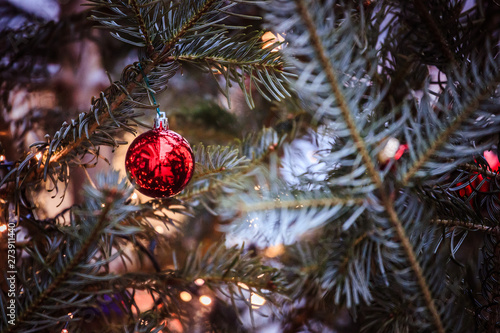 Magical Christmas market  Decoration with Christmas bauble on a fir branch.