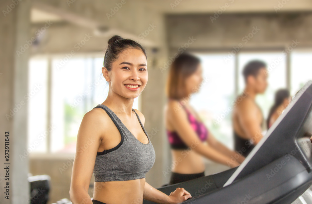 Young Woman exercise In Gym