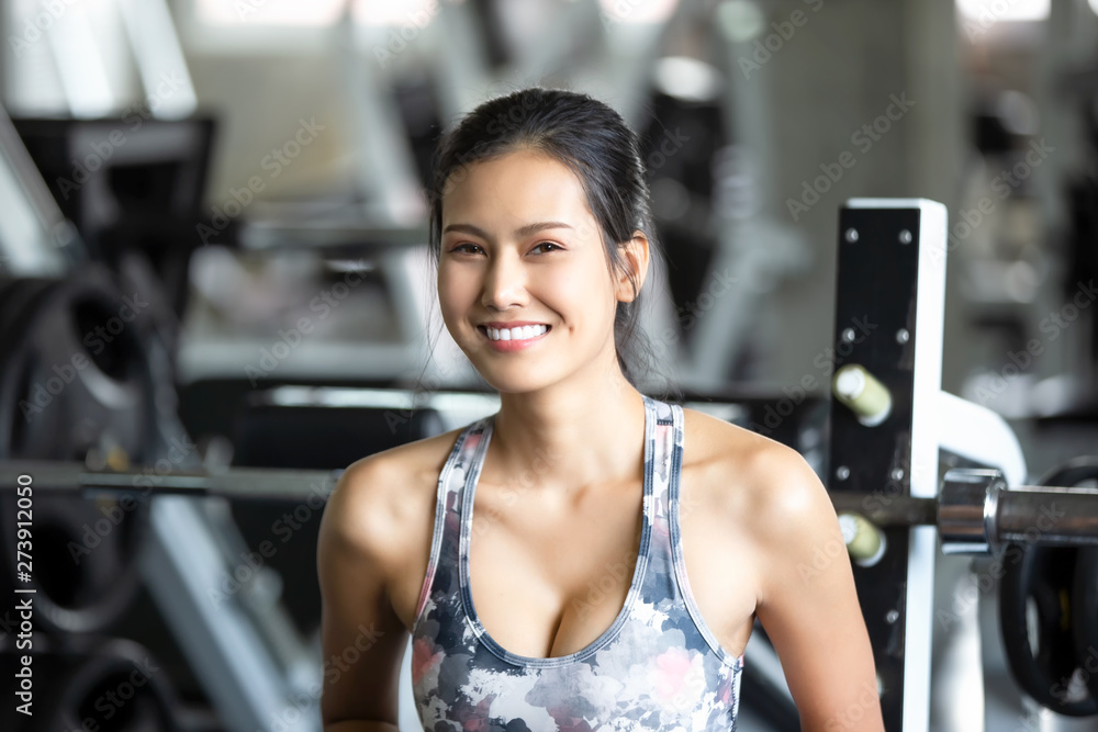 Young Woman Lifting Dumbbell or exercise In Gym Young Woman Lifting Dumbbell or exercise In Gym