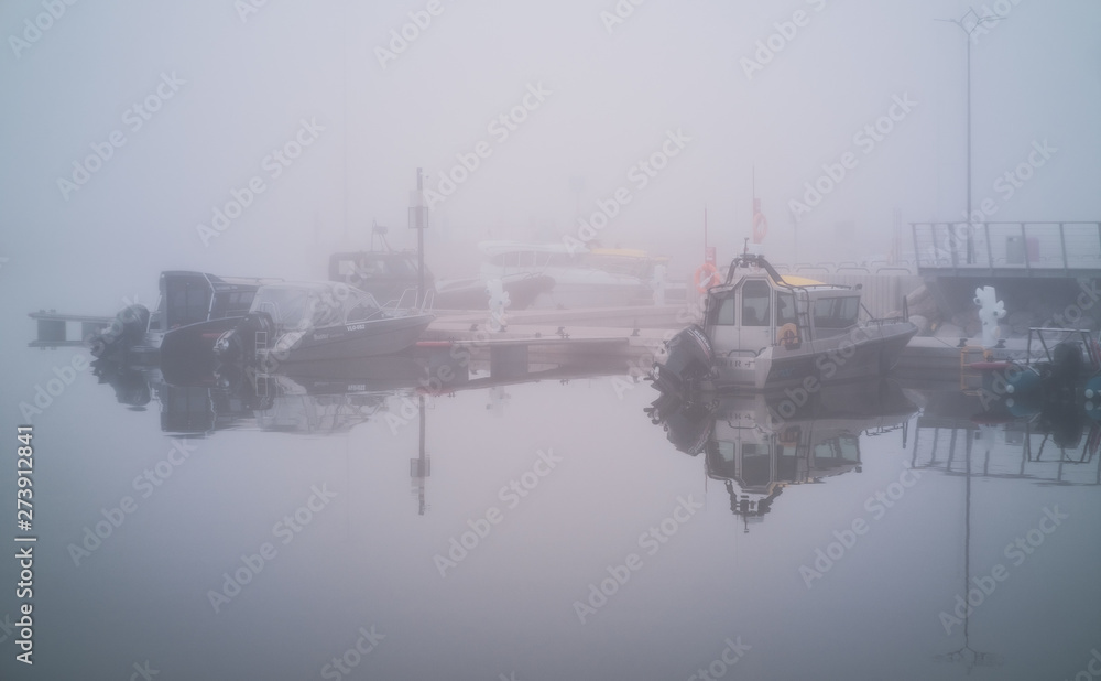 Fishing boats in fog