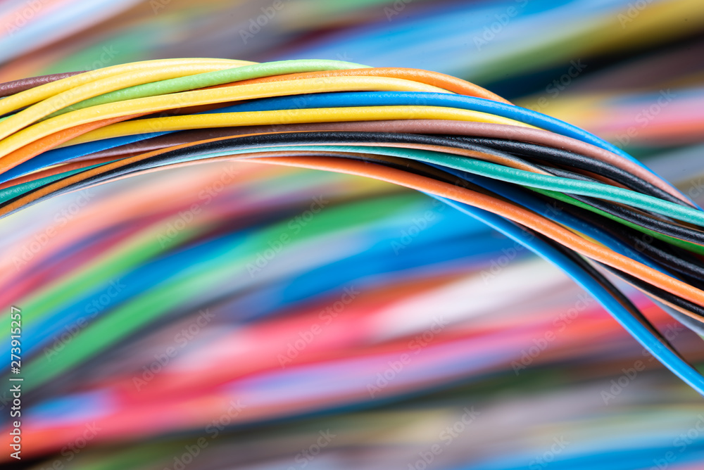 Swirl of colorful electrical cables close-up