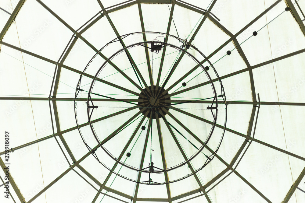 Round glass roof of a building interior – Circular window from a construction interior used for ventilation – Beautiful decorative dome of s gallery or mall-