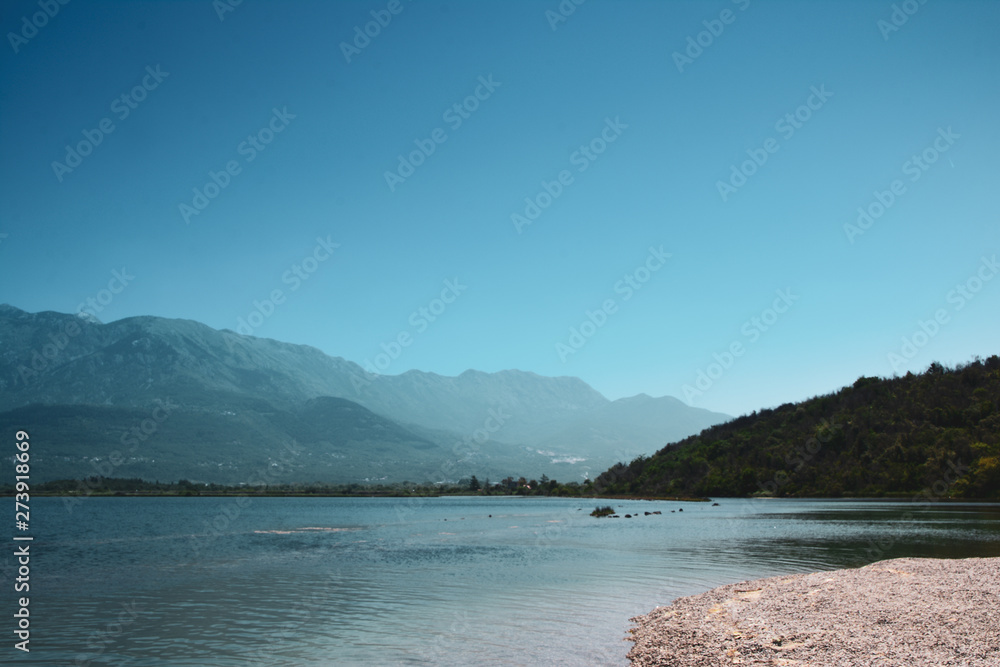 view of the mountains in montenegro coastal sea with blue sky