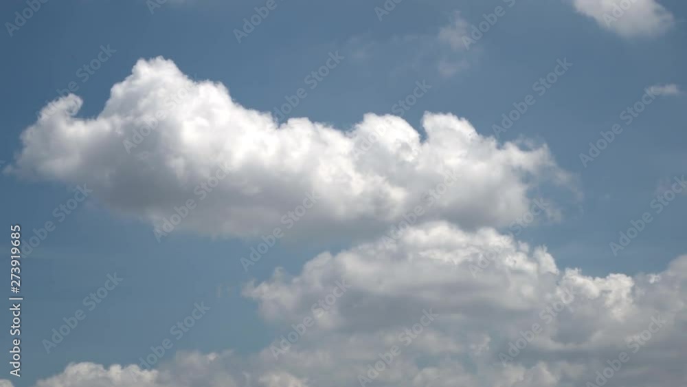 Time lapse of rolling puffy clouds in evening, Time lapse of rolling puffy clouds in evening,