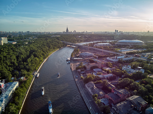 Luzhniki stadium, Moscow river and metro bridge on Sparrow Hills - Vorobyovy Gory, at sunset in Moscow, Russia. Aerial