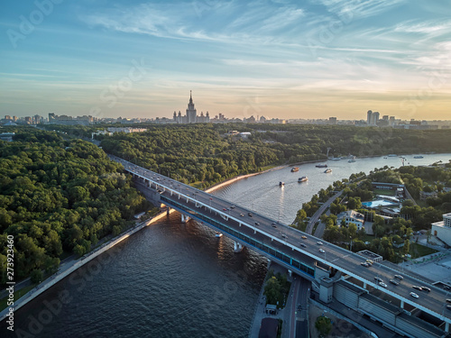 Luzhniki stadium, Moscow river and metro bridge on Sparrow Hills - Vorobyovy Gory, at sunset in Moscow, Russia. Aerial