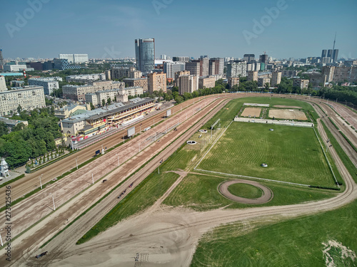 Racing track in non racing day without horses and main building at Moscow hippodrome on summer day - aerial view