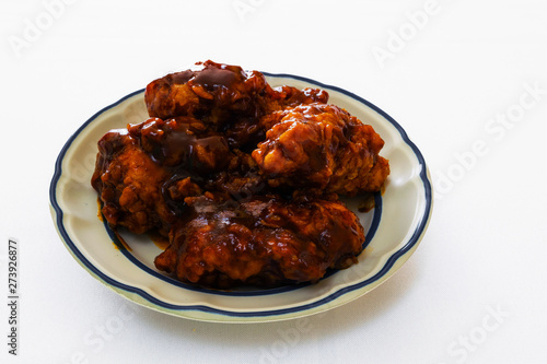 isolated plate of chicken wings with bbq sauce