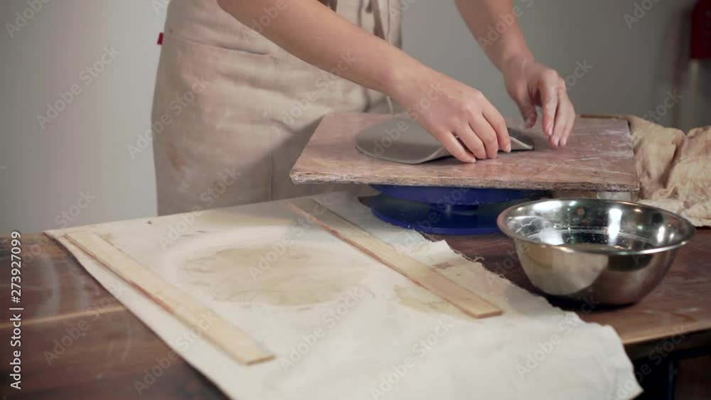 Woman working with a clay indoor. Woman working with a clay indoor.
