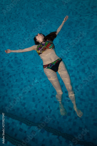 UAE. Woman, swimming pool, relax