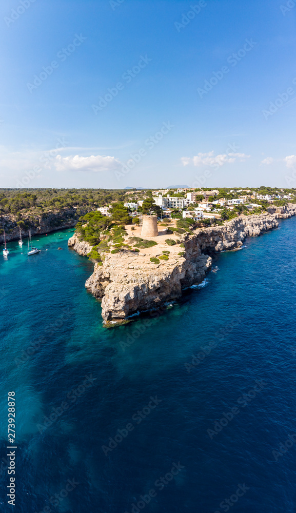 Spain, Balearic Islands, Mallorca, Llucmajor, Aerial view of bay of Cala Pi and Torre de Cala Pi Spain, Balearic Islands, Mallorca, Llucmajor, Aerial view of bay of Cala Pi and Torre de Cala Pi