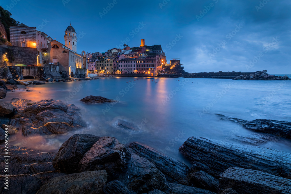 Panorama of night fishing village Vernazza with Santa Margherita Church and lookout tower, Cinque Terre, Italy