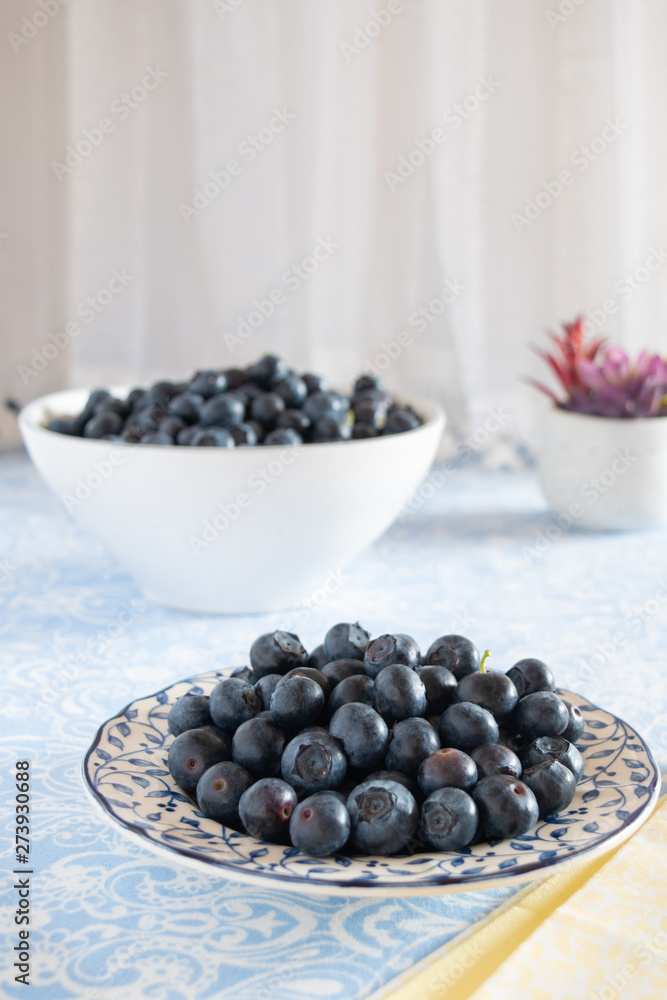 Fresh picked blueberries in a light and bright kitchen environment. Fresh picked blueberries in a light and bright kitchen environment.