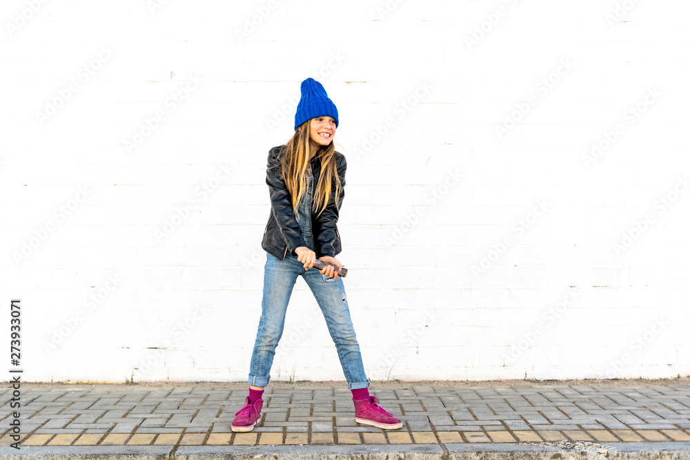Smiling girl with smoke torch in front of white wall Smiling girl with smoke torch in front of white wall