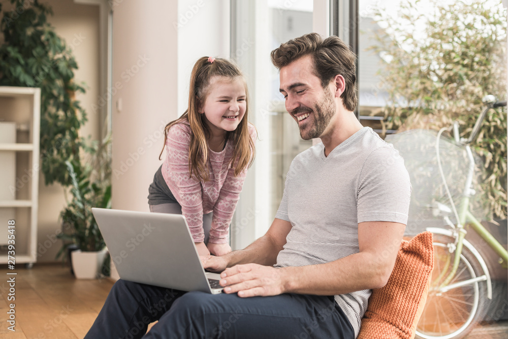 Young man and little girl surfing the net together Young man and little girl surfing the net together