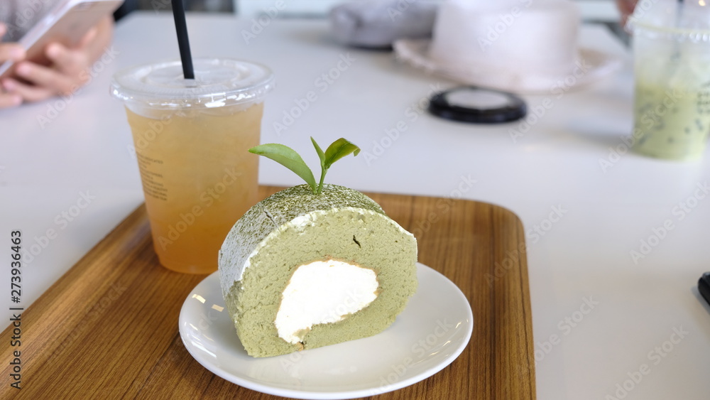 Green tea Chiffon roll on plate. Restaurant, bakery menu or recipe concept. Copy space Green tea Chiffon roll on plate. Restaurant, bakery menu or recipe concept. Copy space