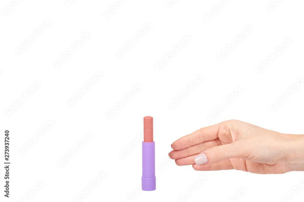 Hand with pink balm lipstick, lips care and beauty Hand with pink balm lipstick, lips care and beauty