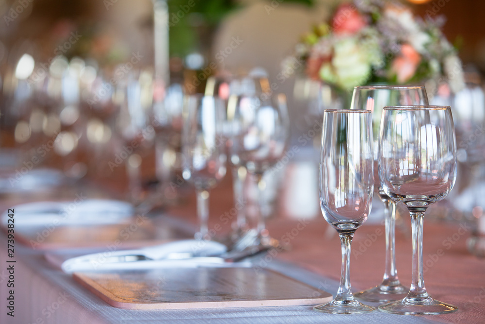 Wine and champagne glasses on decorated table