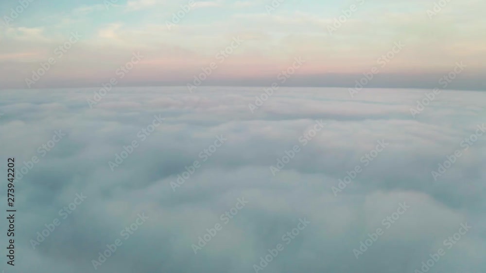Beautiful misty dawn. Flying above the clouds, drone video Beautiful misty dawn. Flying above the clouds, drone video